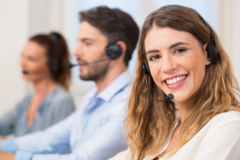 woman with headset smiling call centre